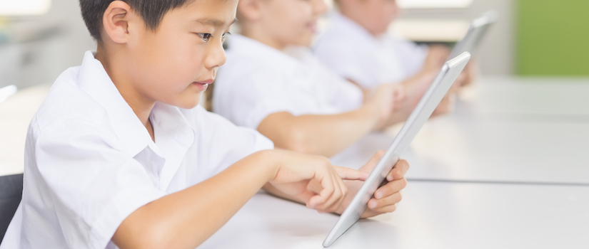 “student-using-ipad-in-classroom“