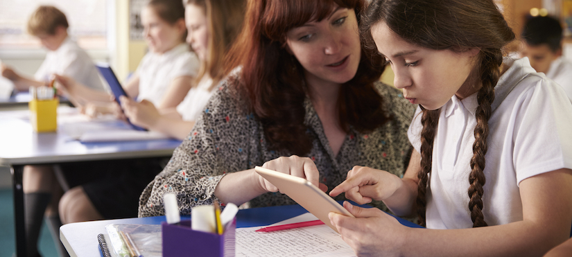 teacher-with-student-in-classroom