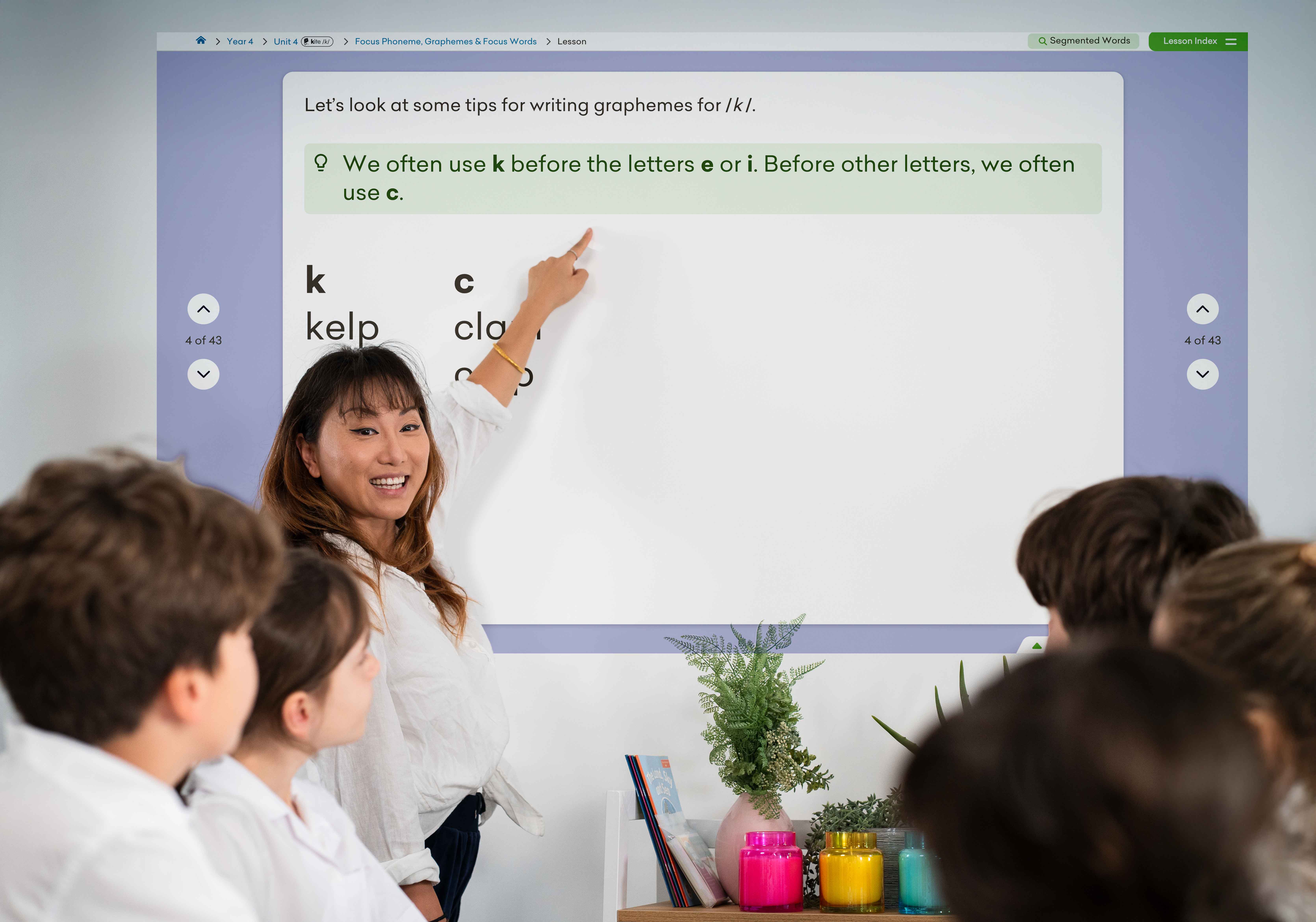 teacher at interactive whiteboard